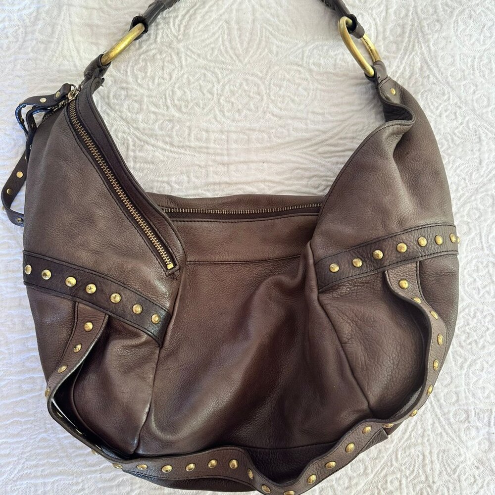 Kenneth Cole boho luxurious leather with brass adornments